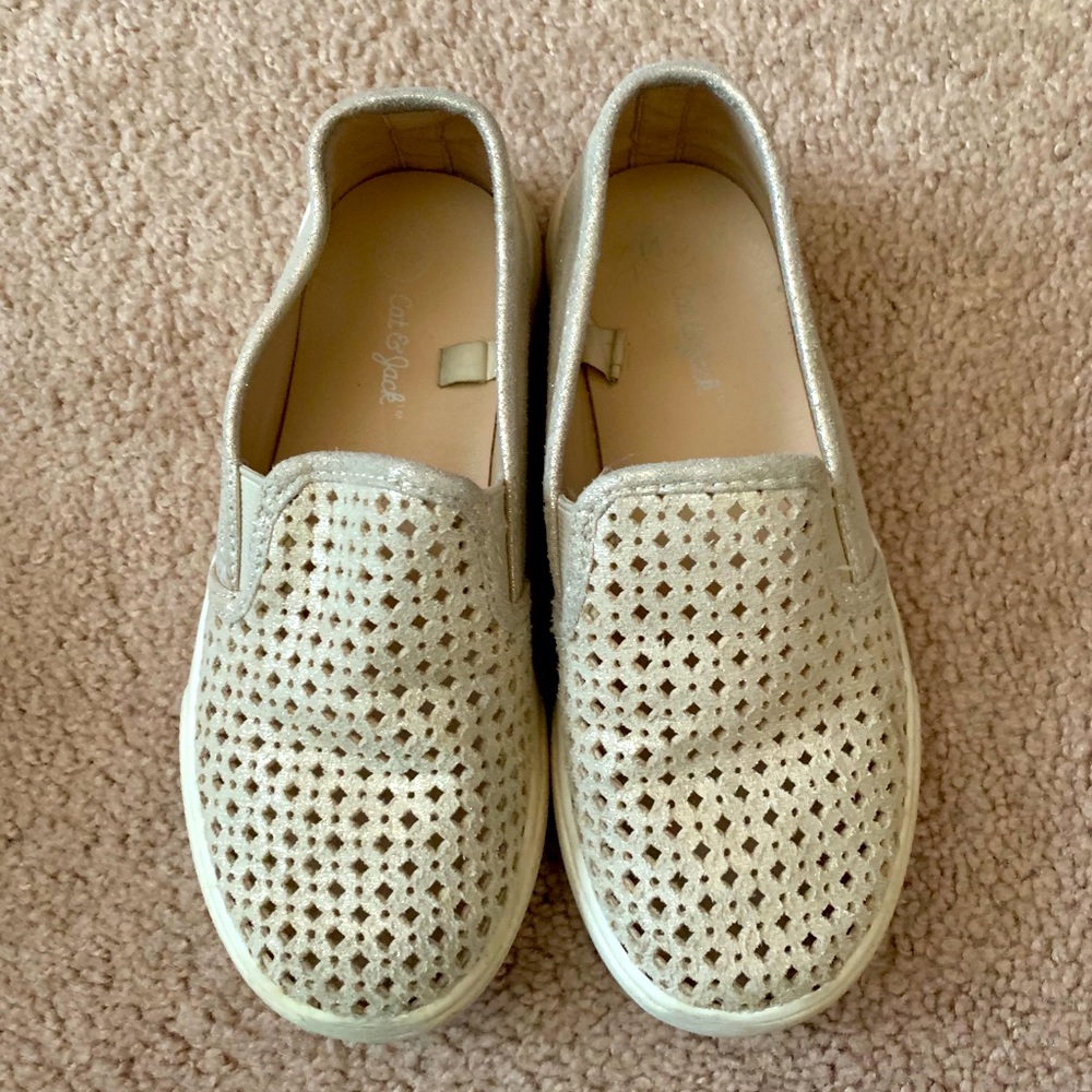 Girls’ gold slip on shoes